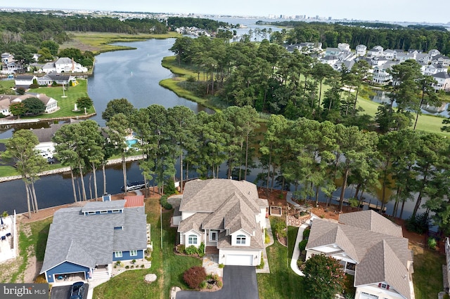 birds eye view of property featuring a residential view and a water view