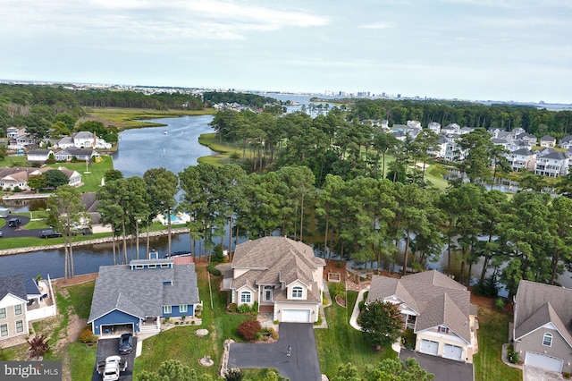 birds eye view of property featuring a residential view and a water view