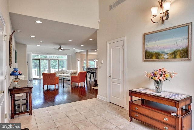 entryway with recessed lighting, visible vents, a ceiling fan, light tile patterned flooring, and baseboards