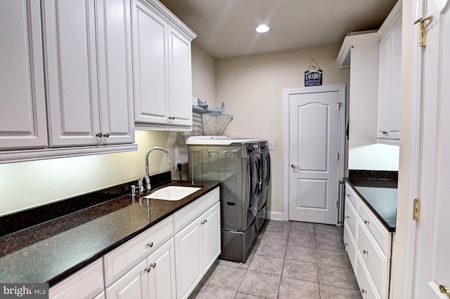 laundry room with light tile patterned floors, recessed lighting, cabinet space, a sink, and washer and dryer