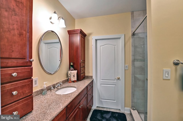 bathroom featuring a shower stall and vanity