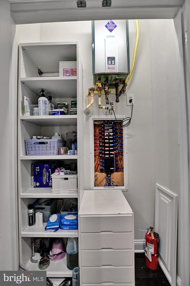 interior space featuring tankless water heater