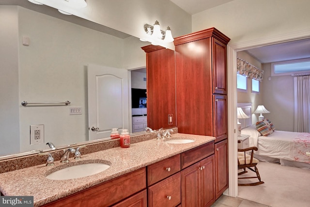 bathroom featuring a sink and double vanity