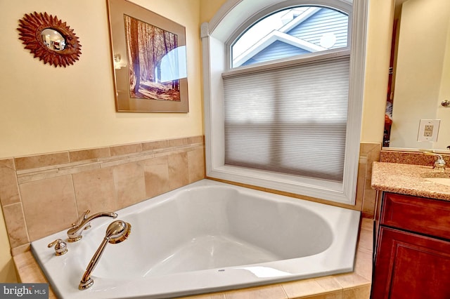 bathroom featuring a bath and vanity