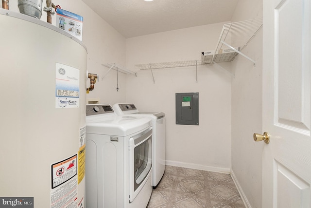 washroom with gas water heater, light floors, washing machine and dryer, laundry area, and electric panel