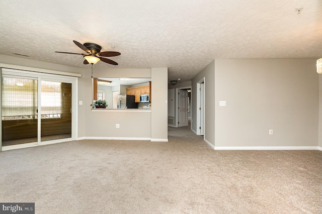 unfurnished living room featuring light carpet and baseboards