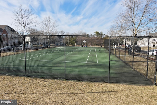 view of sport court with fence