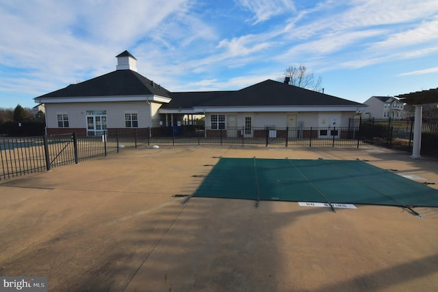 pool featuring a patio area and fence