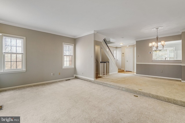 interior space featuring carpet, a healthy amount of sunlight, and stairway