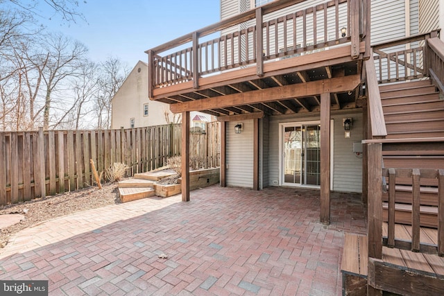 view of patio / terrace with a deck and a fenced backyard