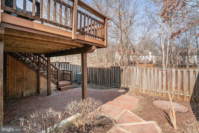 view of patio with a fenced backyard and stairs