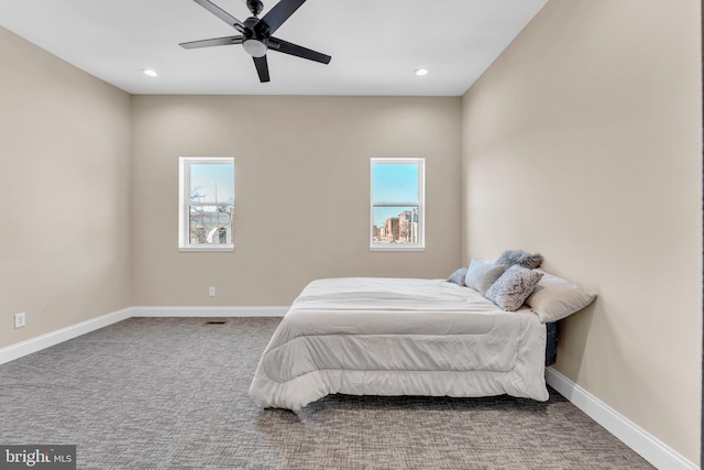 carpeted bedroom featuring ceiling fan, recessed lighting, and baseboards