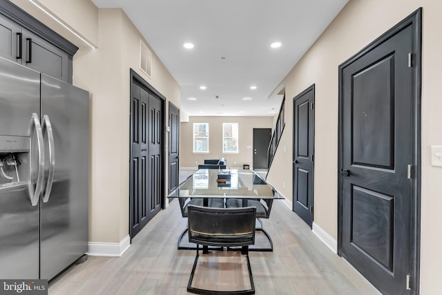 dining space featuring baseboards, light wood finished floors, visible vents, and recessed lighting