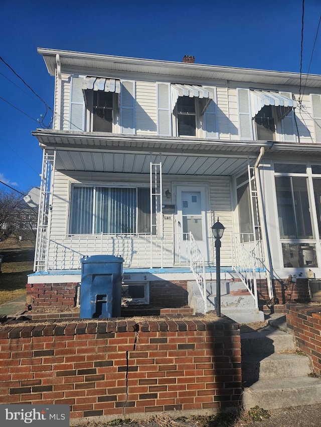 view of property with a porch