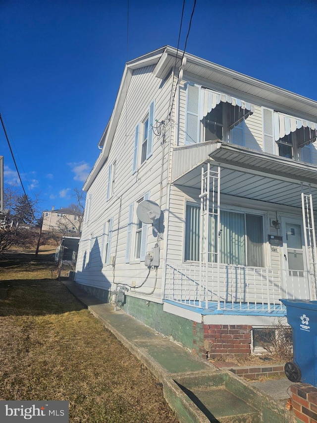 view of property exterior featuring a porch