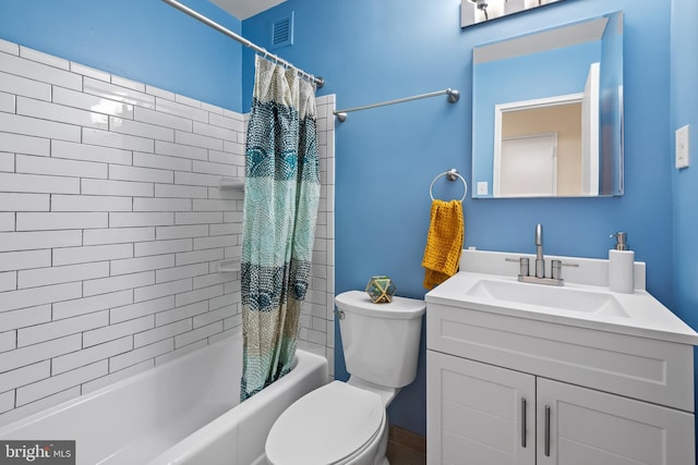 bathroom featuring toilet, vanity, shower / bath combination with curtain, and visible vents