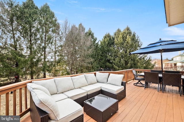 deck featuring outdoor dining space and an outdoor hangout area