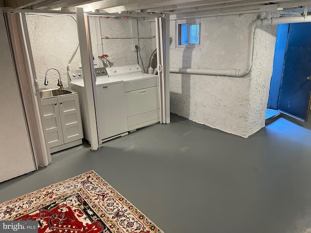 clothes washing area with laundry area, independent washer and dryer, and a sink