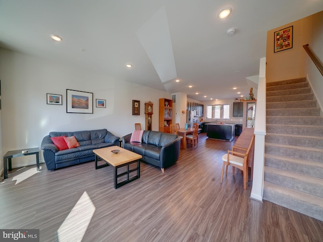 living area with stairway, wood finished floors, and recessed lighting