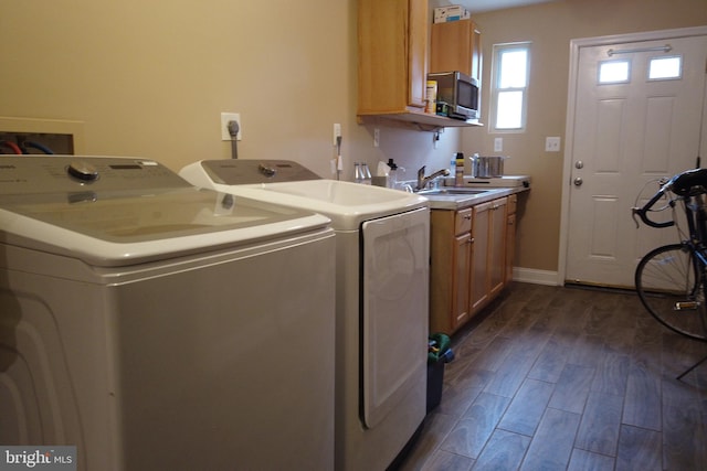 4136 E Capitol St NE, Washington, DC 20019 - laundry area with washer and dryer, dark wood-style flooring, and cabinet space