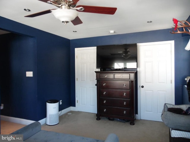 bedroom featuring carpet flooring, a ceiling fan, and baseboards