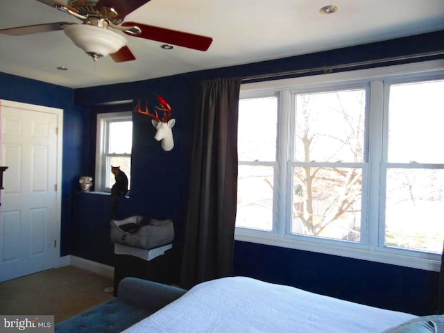 bedroom featuring ceiling fan and baseboards