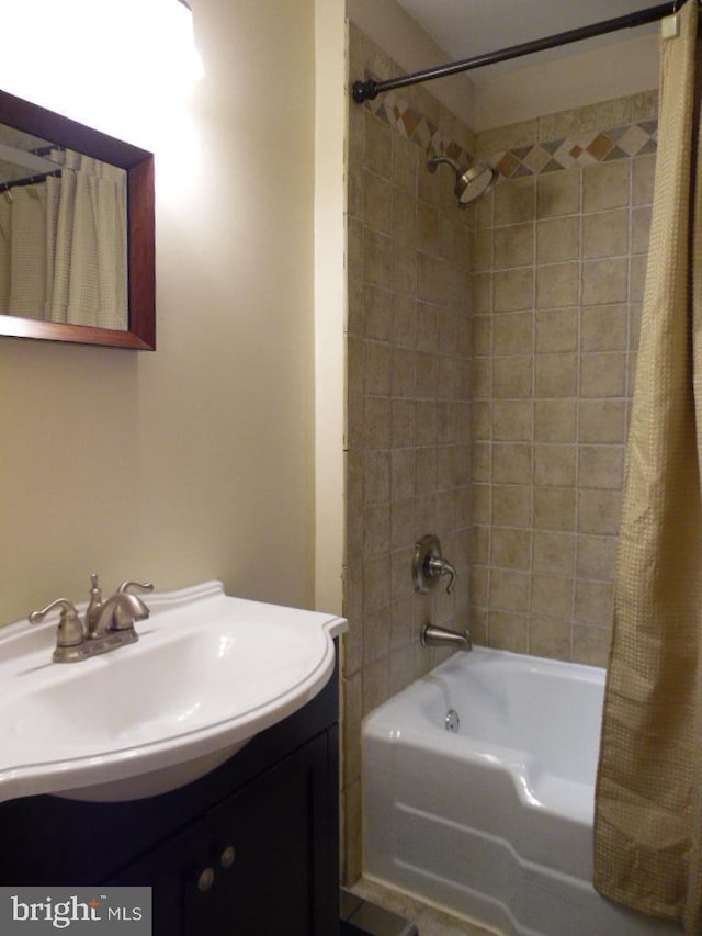 bathroom with vanity and shower / bath combo with shower curtain