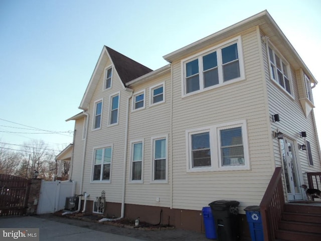 rear view of house with fence