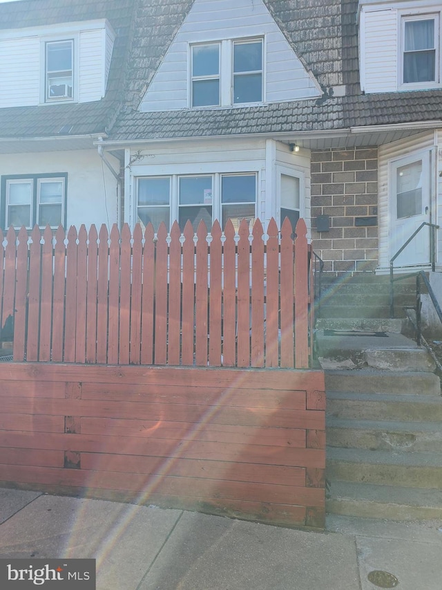 exterior space featuring brick siding