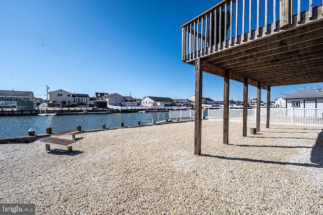 exterior space with a water view and a residential view