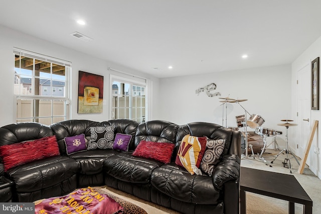 living room featuring visible vents and recessed lighting