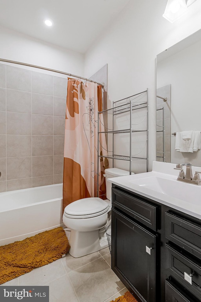 bathroom with shower / bath combination with curtain, vanity, toilet, and tile patterned floors