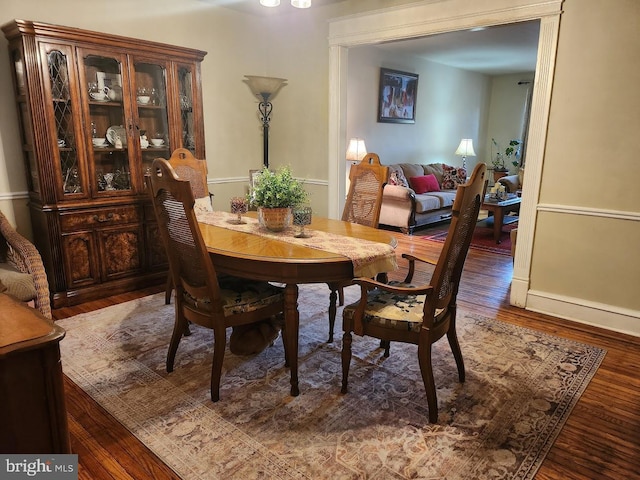 dining area with wood finished floors