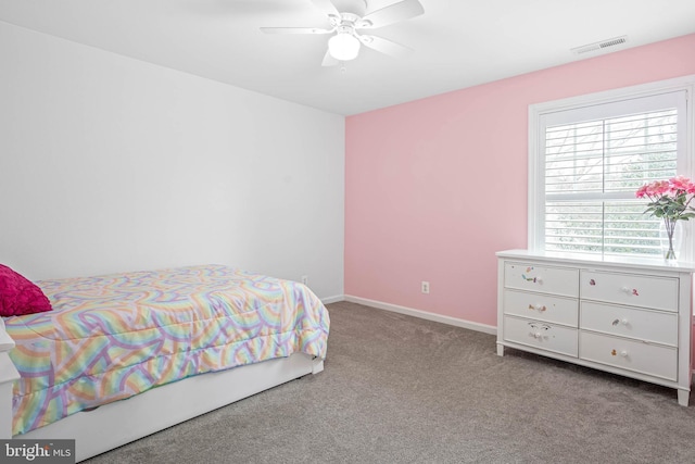 bedroom featuring a ceiling fan, carpet flooring, visible vents, and baseboards