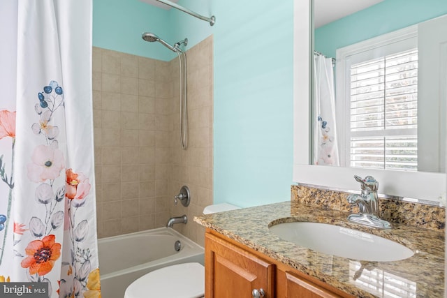 bathroom featuring shower / bath combo, vanity, and toilet