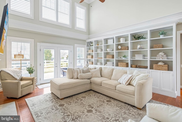 interior space with a ceiling fan and french doors