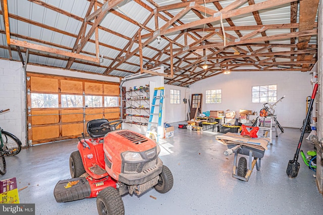 garage featuring concrete block wall and metal wall