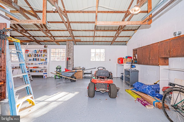 garage featuring metal wall and concrete block wall