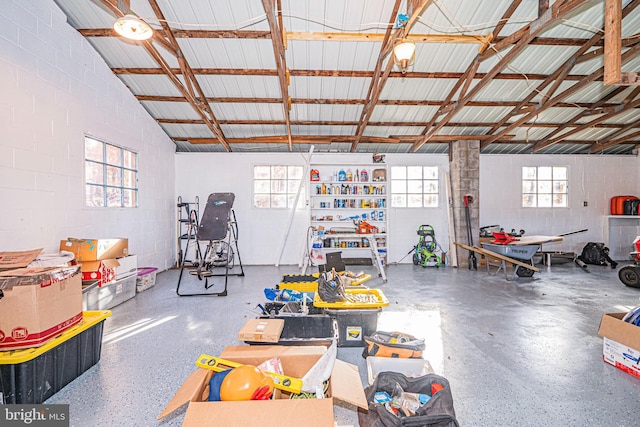 garage with concrete block wall and metal wall