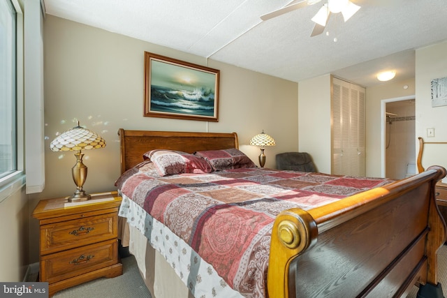 carpeted bedroom with a closet and ceiling fan