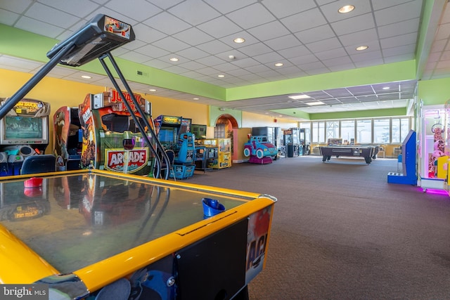 game room with a paneled ceiling and recessed lighting