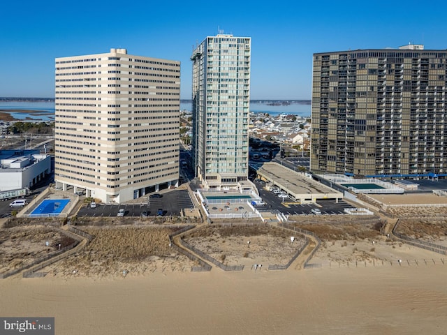 exterior space featuring a water view and a view of city