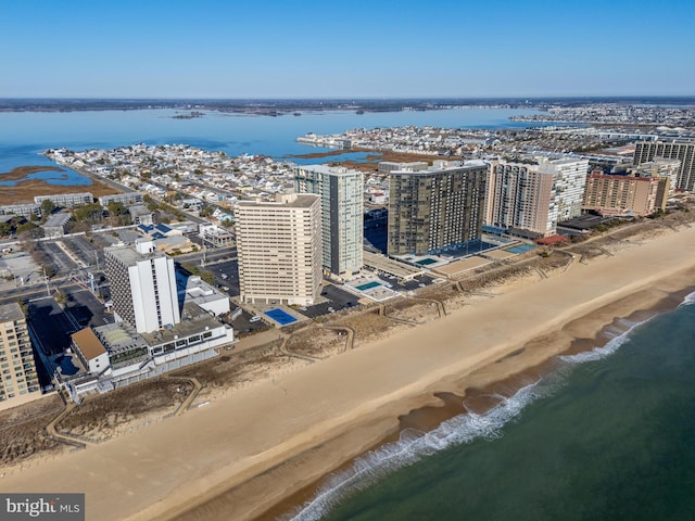 aerial view with a view of city, a water view, and a beach view