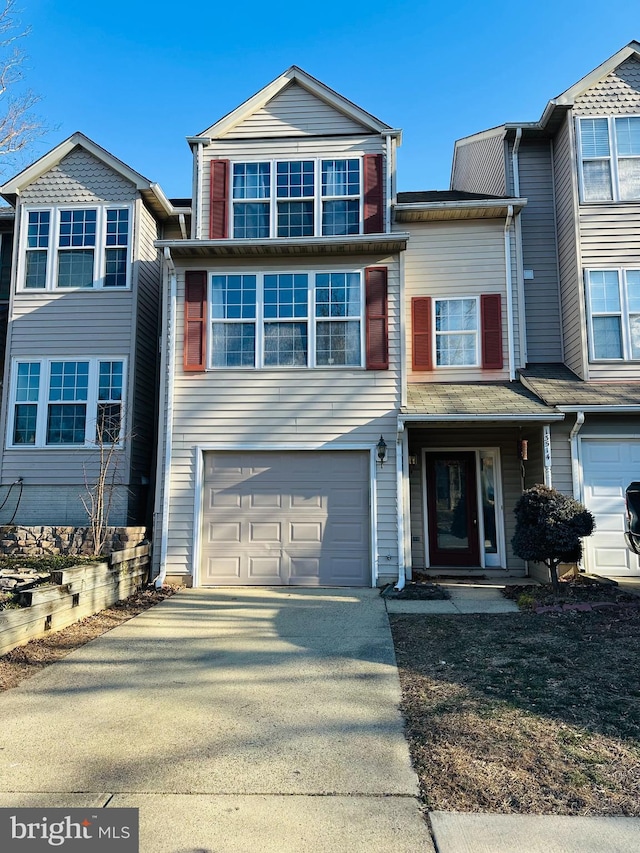 view of front of property with driveway and an attached garage