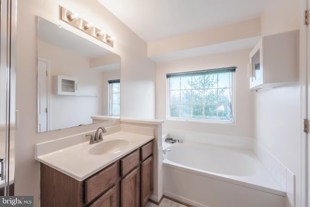 full bath featuring a bath and vanity