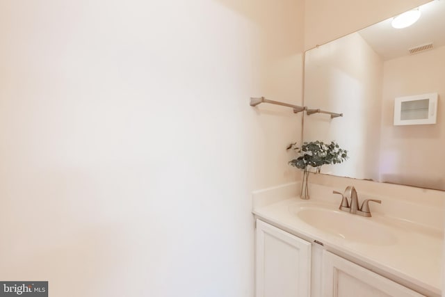 bathroom with visible vents and vanity