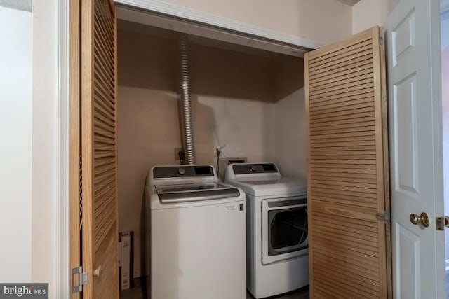 laundry area with laundry area and independent washer and dryer