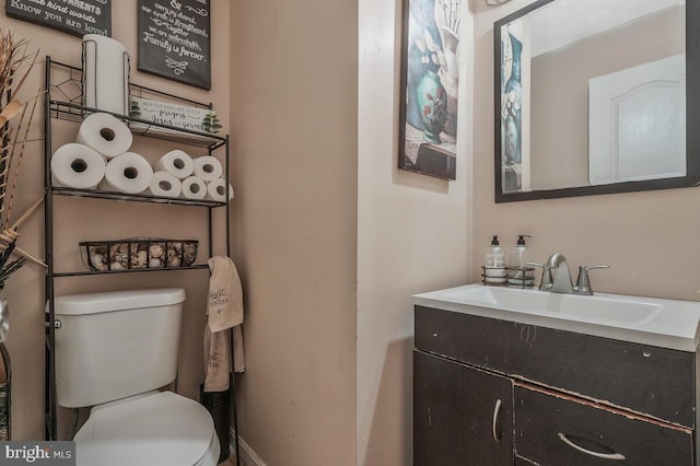 half bath with vanity and toilet