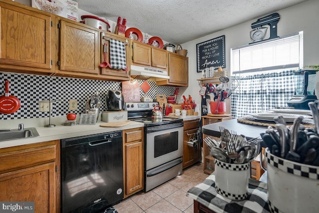 kitchen with light tile patterned flooring, under cabinet range hood, stainless steel range with electric cooktop, black dishwasher, and light countertops