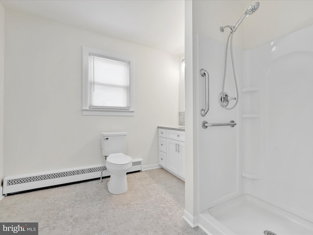 full bathroom featuring toilet, baseboard heating, a stall shower, vanity, and baseboards